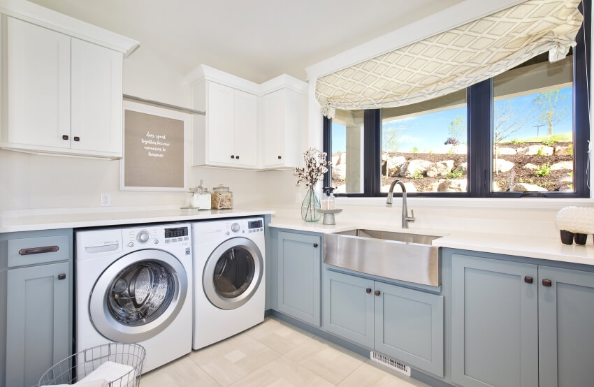 Room with basin sink and grey and white cabinets