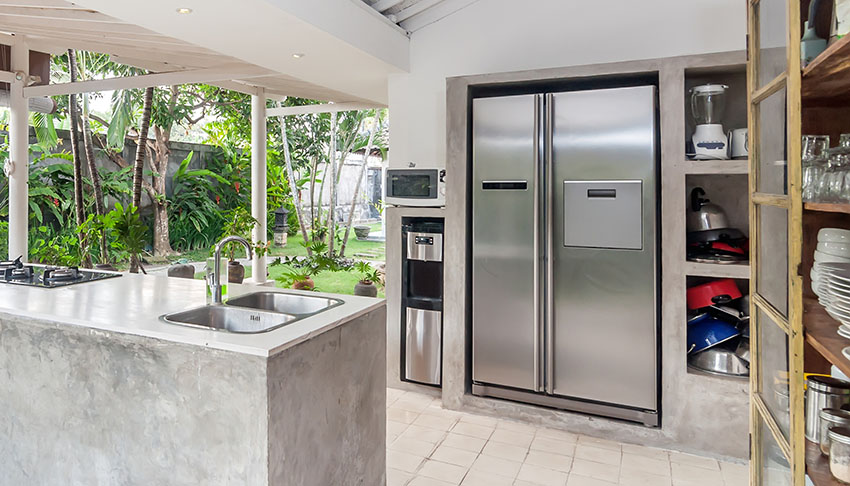 Outdoor kitchen with stainless refrigerator water dispenser