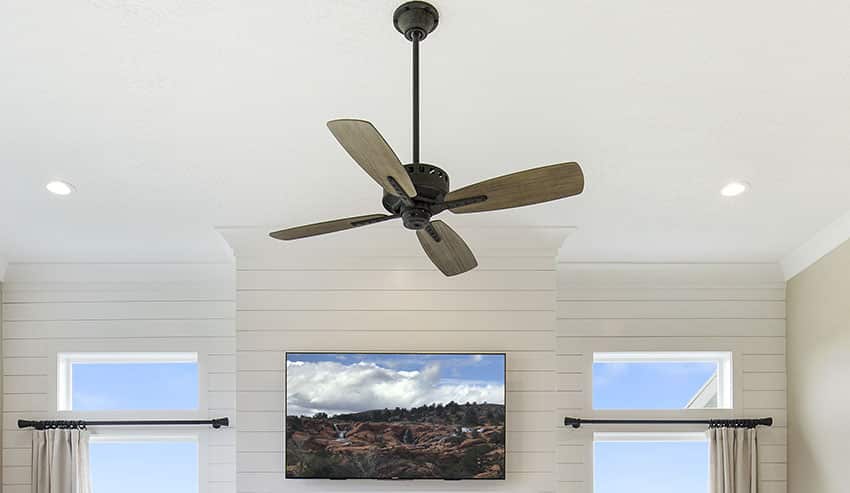 Wooden blade ceiling fan shiplap wall curtain rod