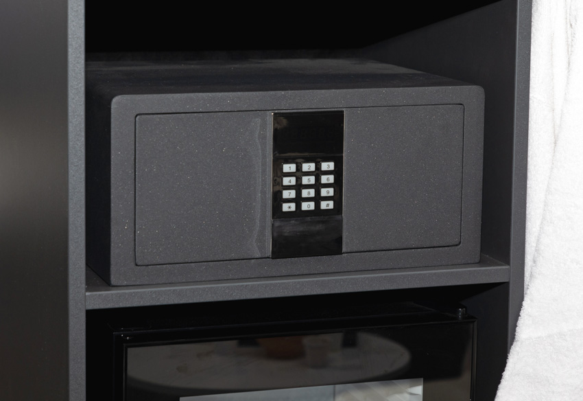 A black safe box with a numeric keypad lock