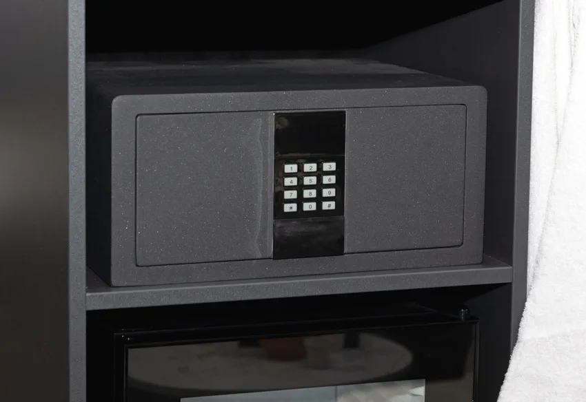A black safe with a numeric keypad lock