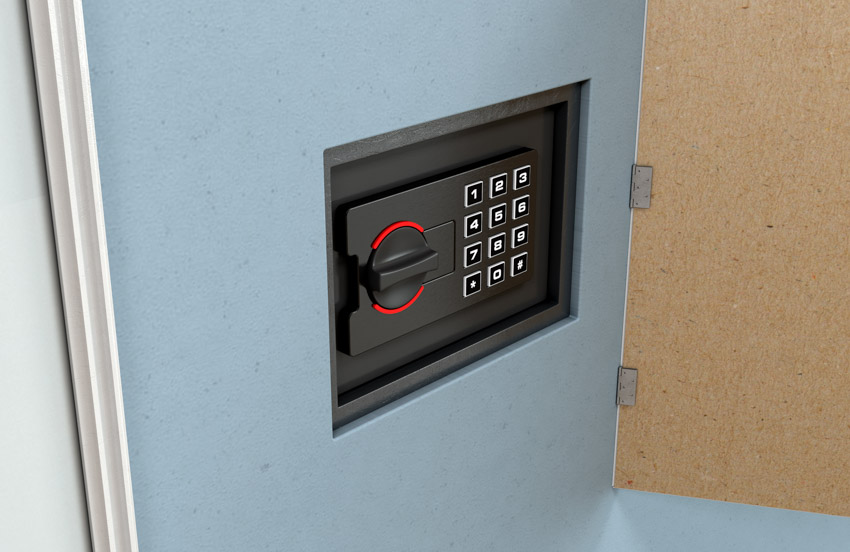 A safe box with numerical keypad installed inside a wall