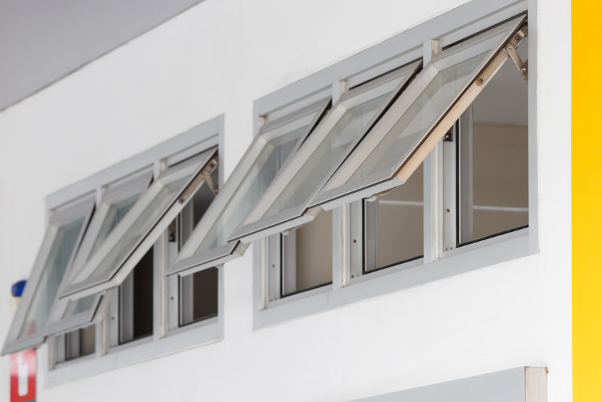 A series of open egress awning windows with metal frame