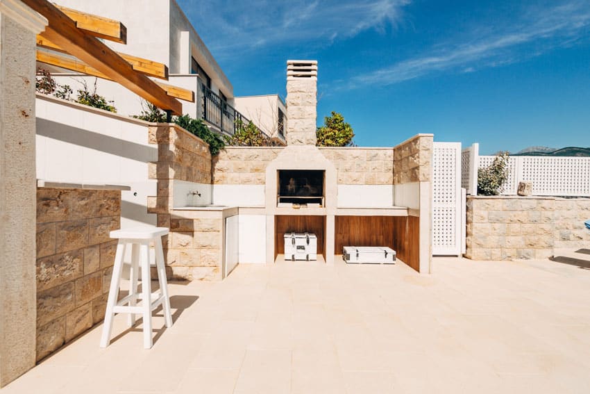 Backyard with stone fireplace with oven feature