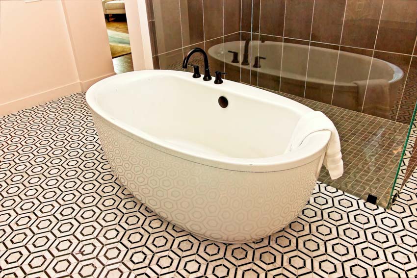 Bathroom with bathtub, and waterproof peel and stick floor tiles