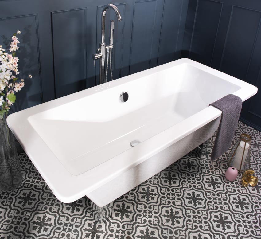 Bathroom with tub, freestanding faucet, and waterproof peel and stick floor tiles