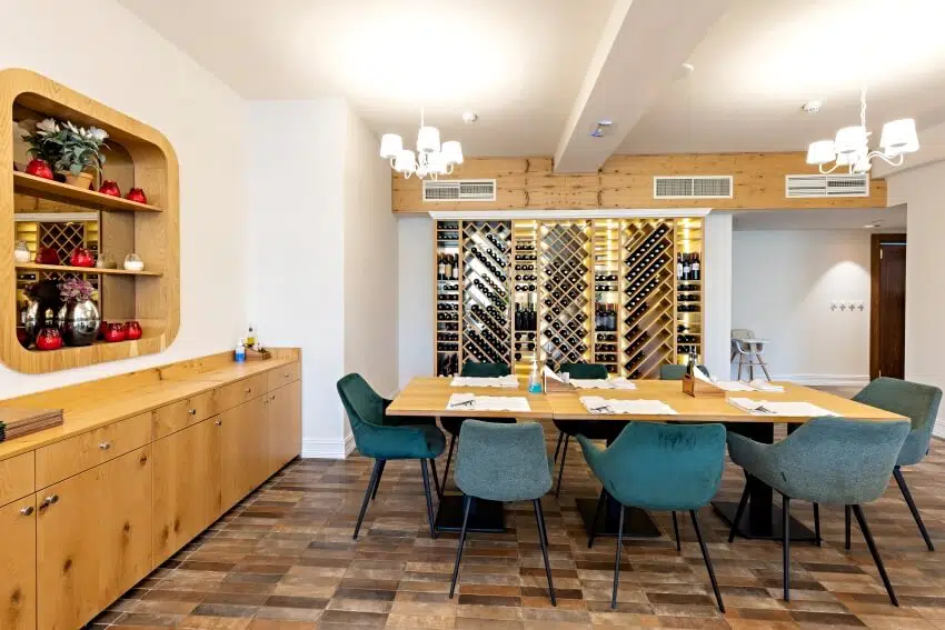 Room with wooden wine shelf, granite floor tiles and hutch dresser