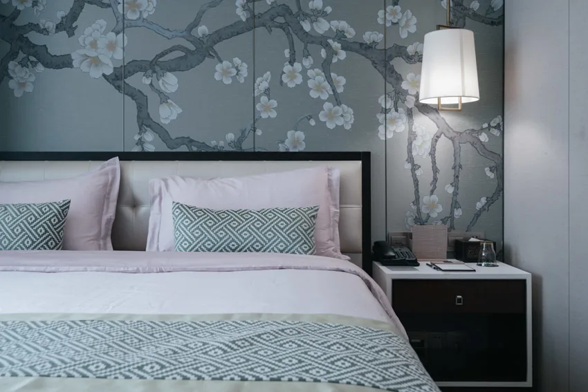 Contemporary bedroom theme with accent wall, and nightstand