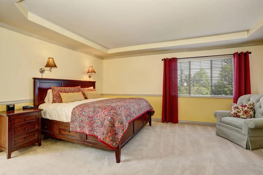 Bed with carpet floor, and shaker style nightstand