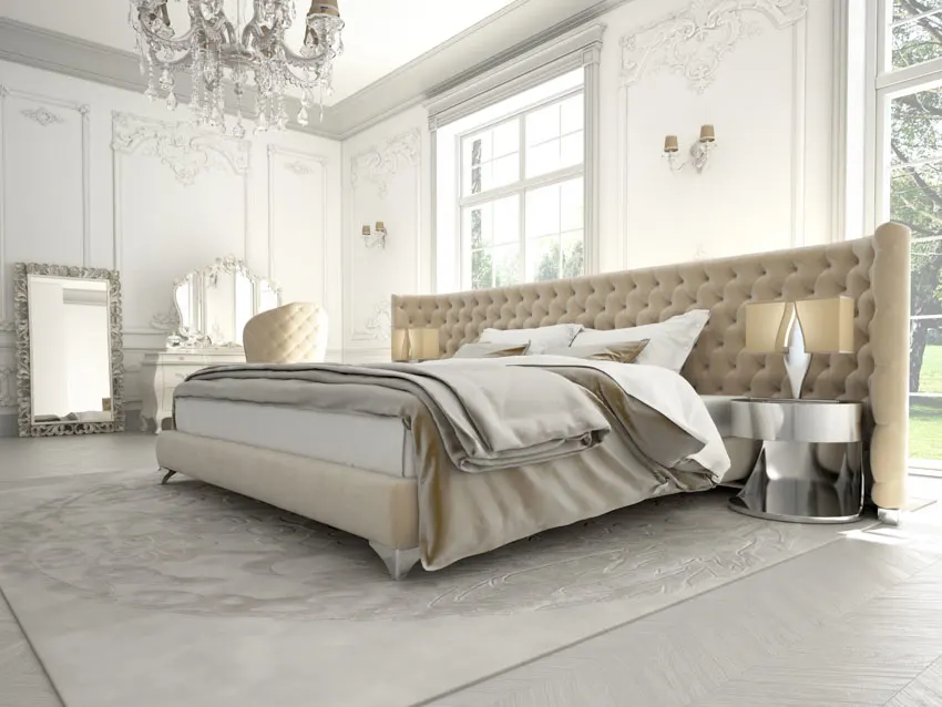 Bed with tufted headboard, silver nightstand, carpet