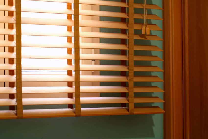 Blinds made of faux wood for windows