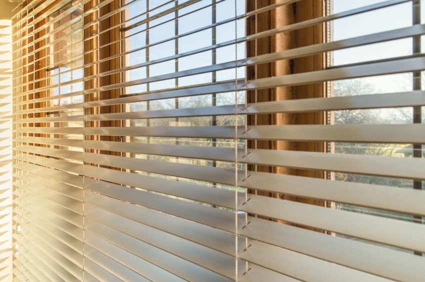 Close up image of window blinds made of faux wood