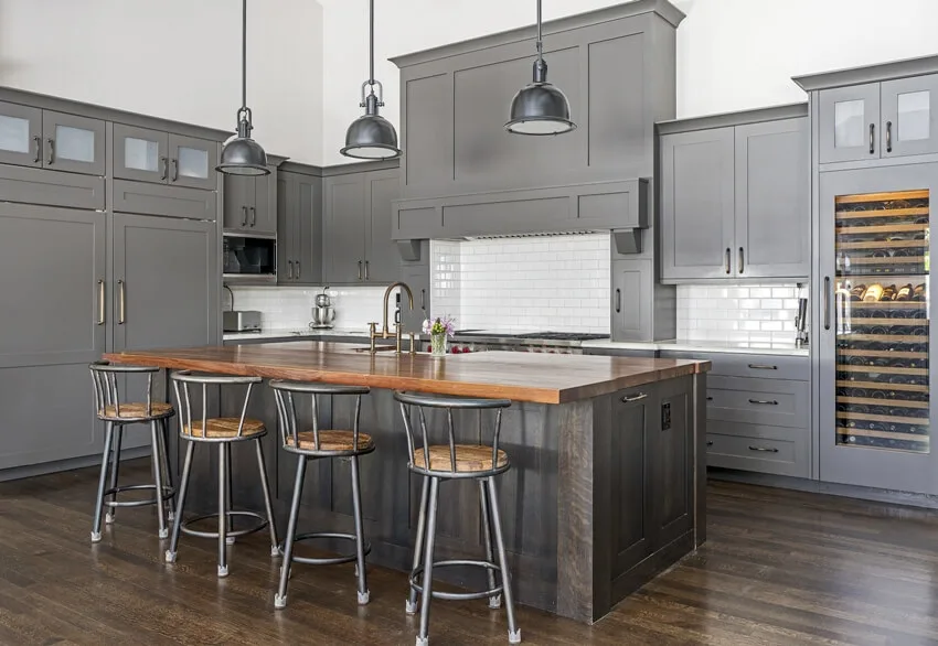 Contemporary kitchen with grey cabinets, pendant lights and beautifully finished ipe wood countertop