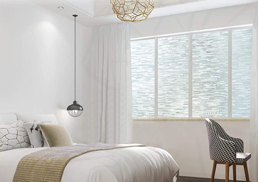 Beautiful bedroom interior with glass covering opaque window film