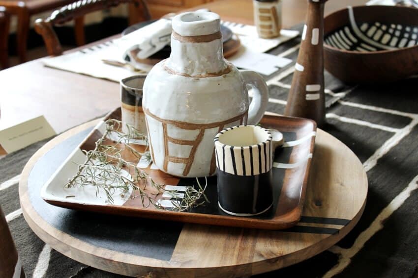 Handmade jug and mugs rest on a lazy susan