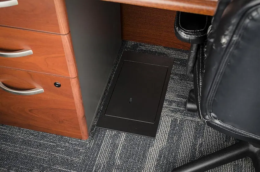 Home office with carpet flooring, drawers, chair, and a floor safe