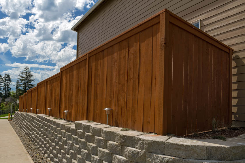 fence and wood siding wall