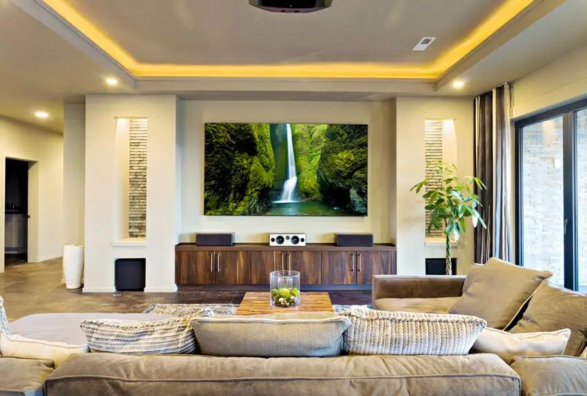 A beautiful in home theater with entertainment units in the living room