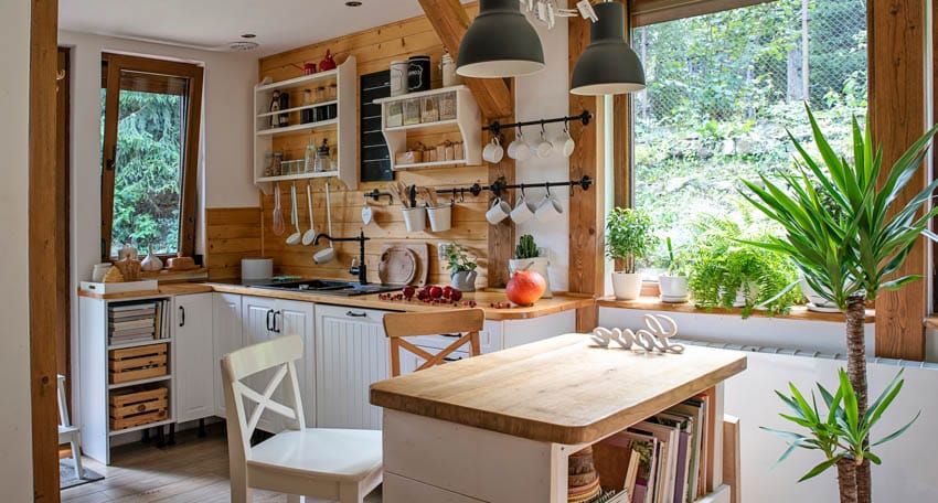 Farmhouse shiplap-type backsplash, hanging lights, and dining set