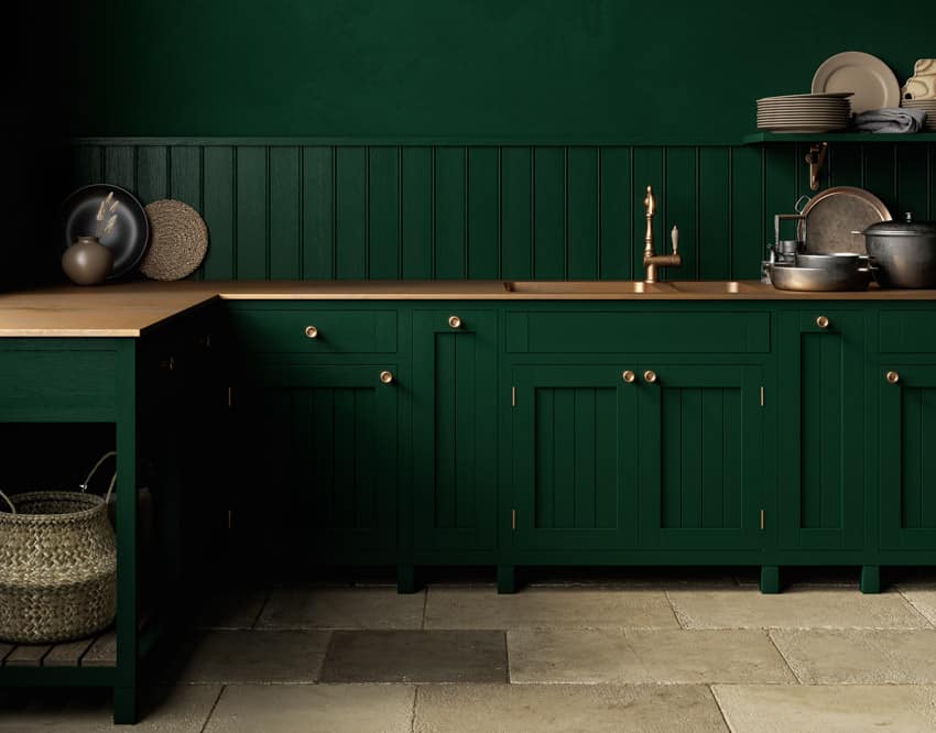 Kitchen with green shiplap and copper countertop