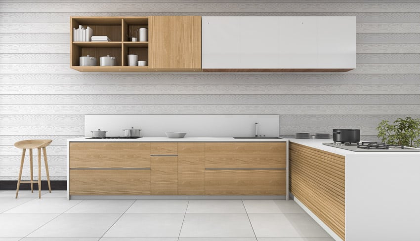 Kitchen with shiplap backsplash, wood cabinets, stool, and kitchenware