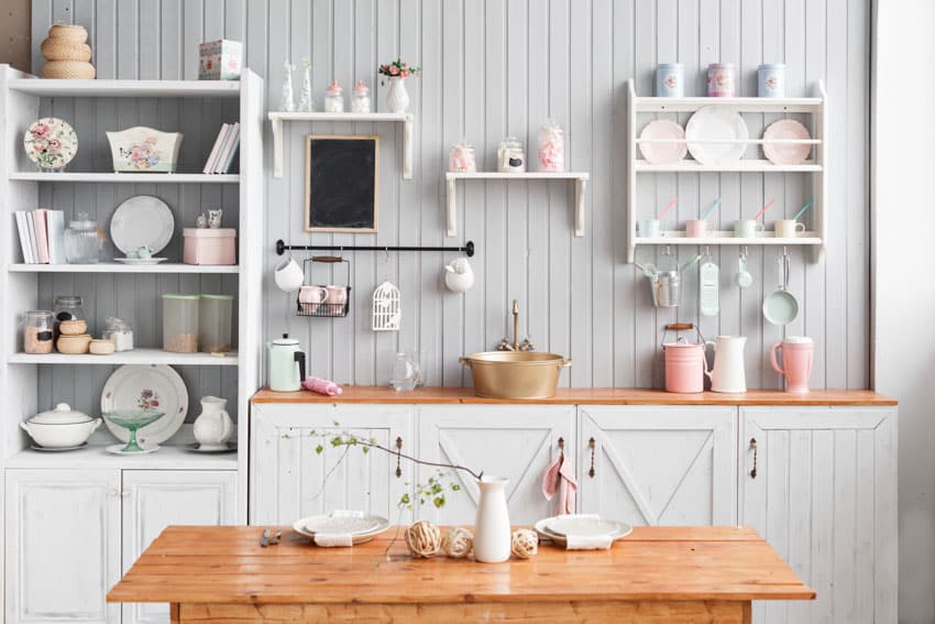 White shiplap accentuated by wooden table in the kitchen