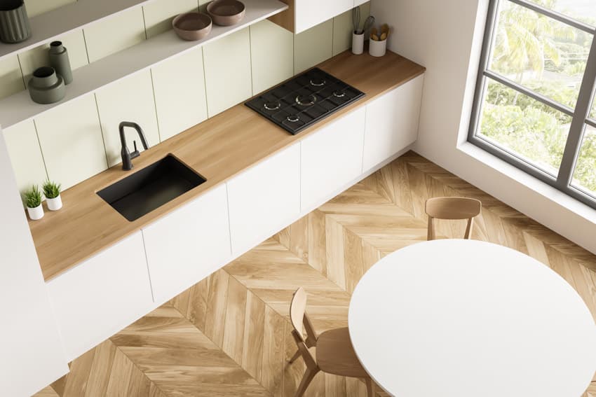 Tongue and groove shiplap, white cabinets and herringbone flooring