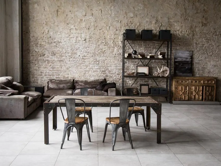 Industrial design room with dark leather seatsa and open shelving