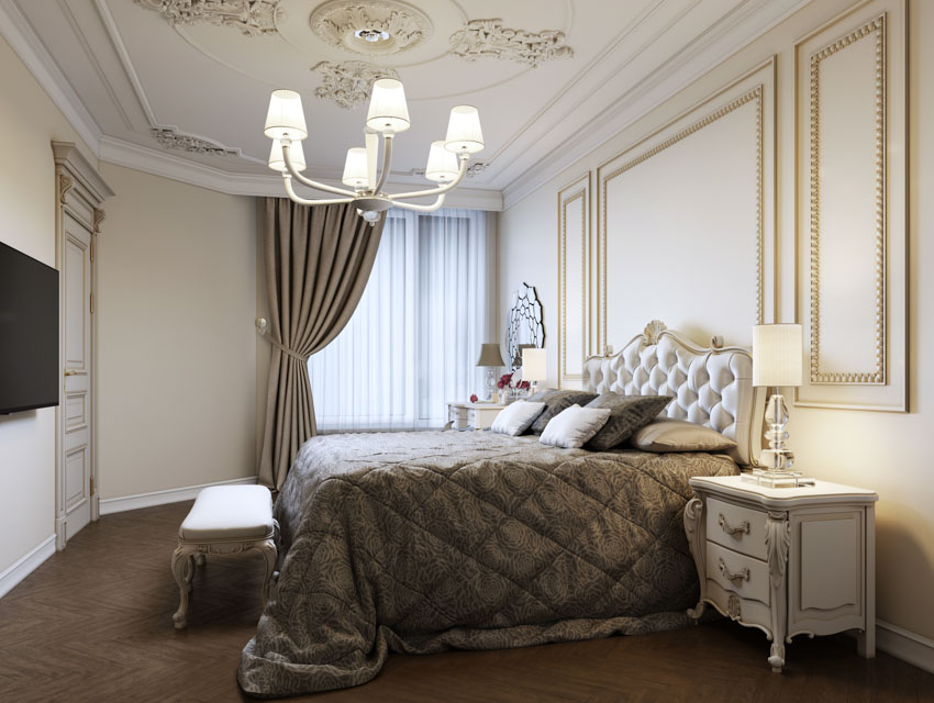 Luxurious bedroom with comforter, Rococo nightstand, windows, curtain, and lamp