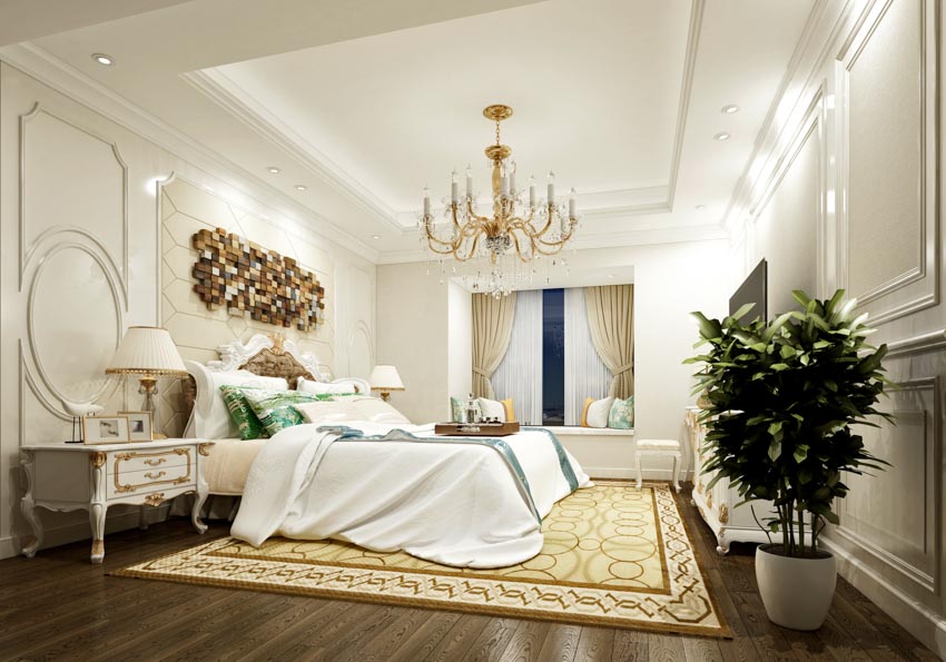 Luxurious bedroom with indoor plant, Louis XIV nightstands, rug, chandelier, and window
