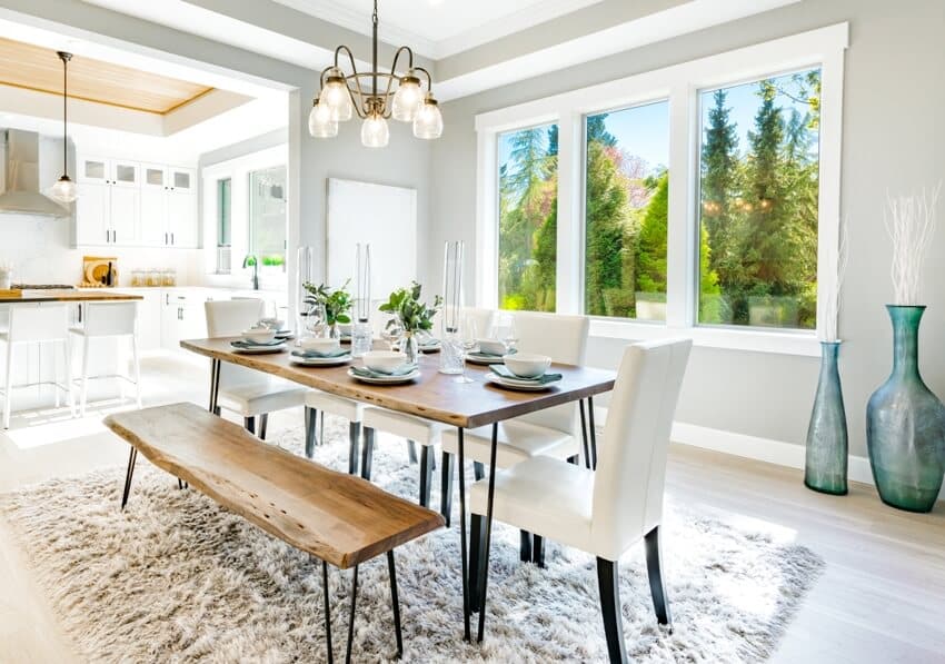 Modern farmhouse dining area with dining room essentials including furniture, lighting and decors