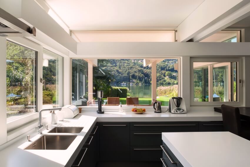 Modern kitchen, white granite countertop and tinted heat control windows