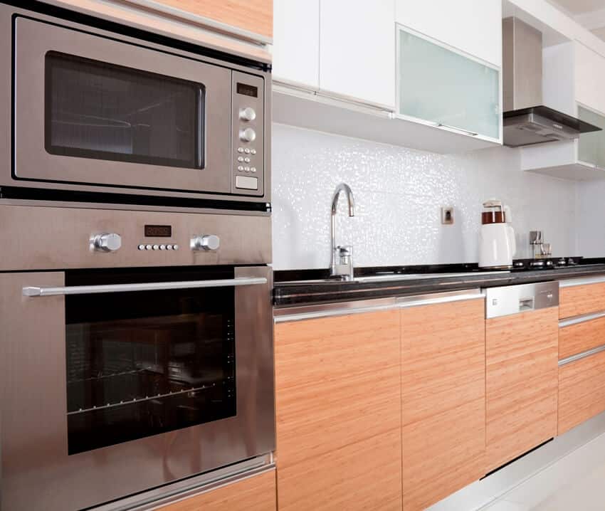Kitchen with stainless steel microwave