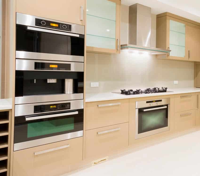 Kitchen with stainless steel appliances and radiant heat microwave