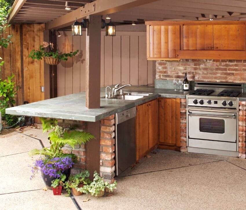 Kitchen with countertops, brown cabinets and shiplap walls 