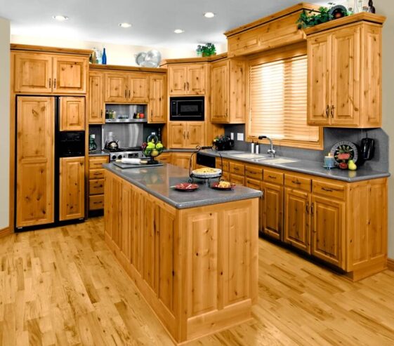 Modern Residential Kitchen With Knotty Alder Kitchen Cabinets Grey Granite Countertops And Wooden Floors Ss 561x493 