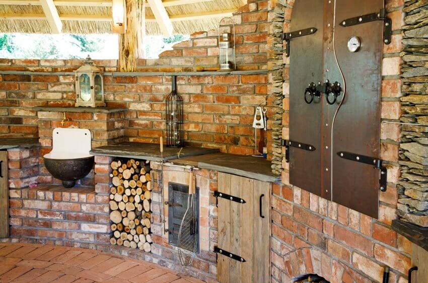 Outdoor old style countryside brick kitchen with flagstone countertop