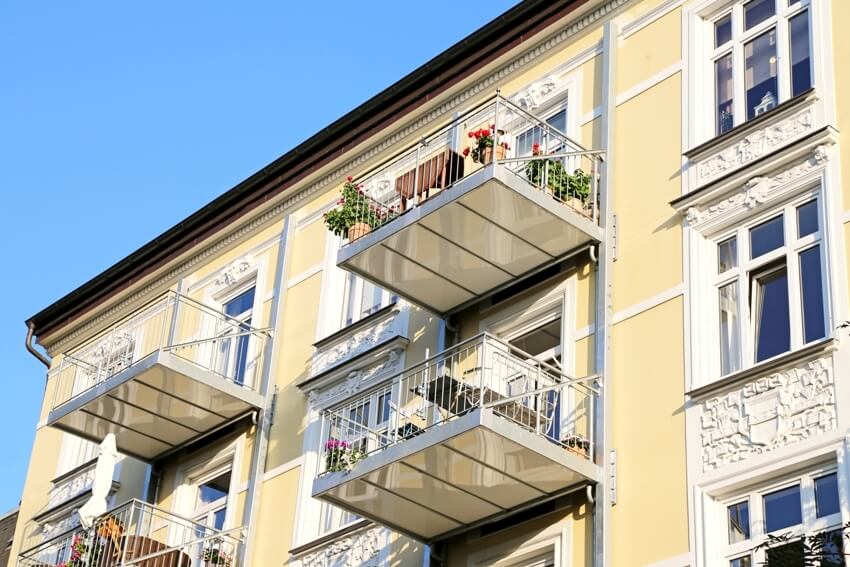 Retrofit hung balconies on old apartment house