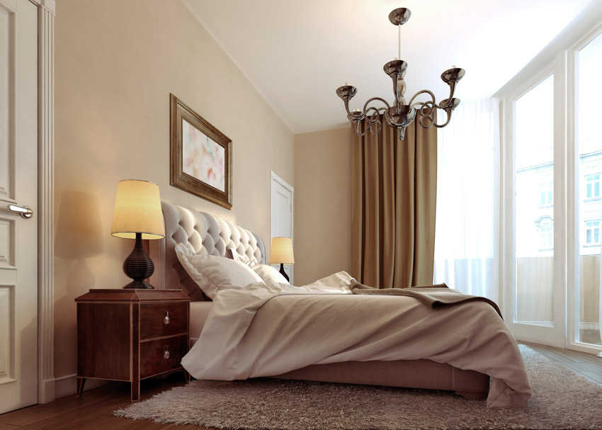 Spacious art deco bedroom with comforter, nightstand