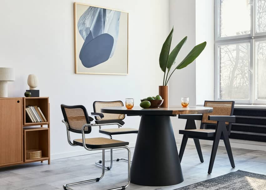 Room with round table, Midmodern Century design chairs and wall art