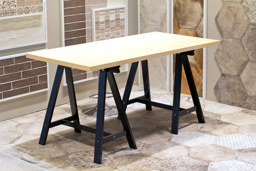 Table with trestle legs and wood surface for dining tables
