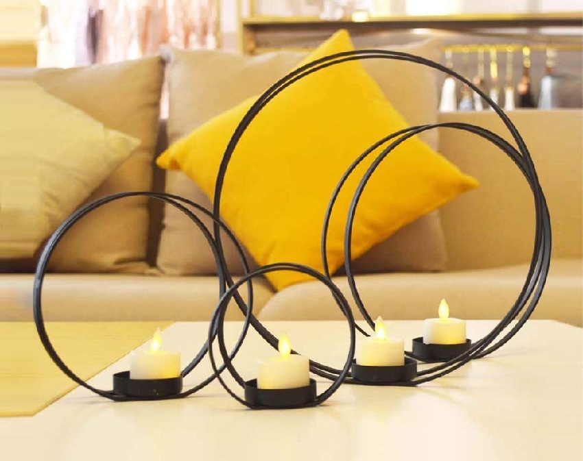Tealight candles on metal ring shape candle holder