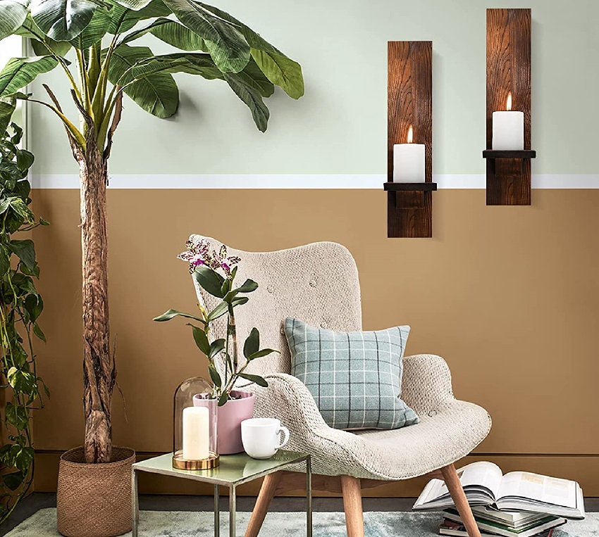 Scandinavian interior design with plants, armchair and wall candle sconces