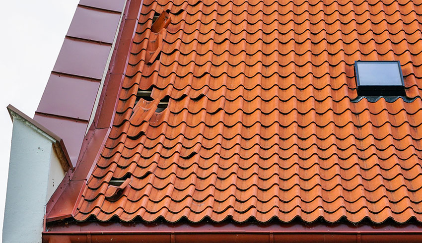 Composite roof tiles with damage