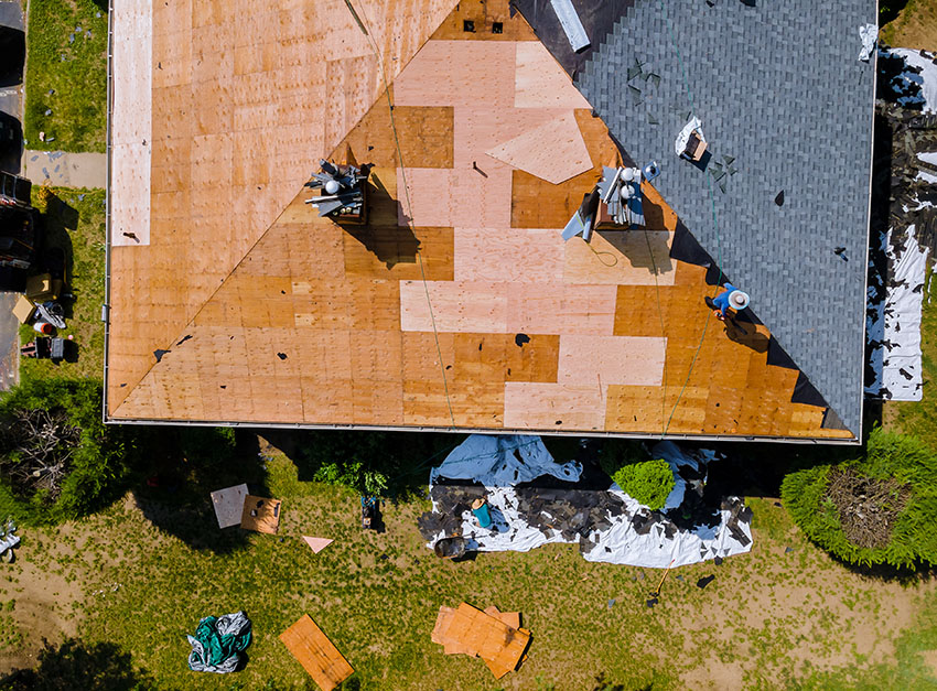 Contractors replacing house roof