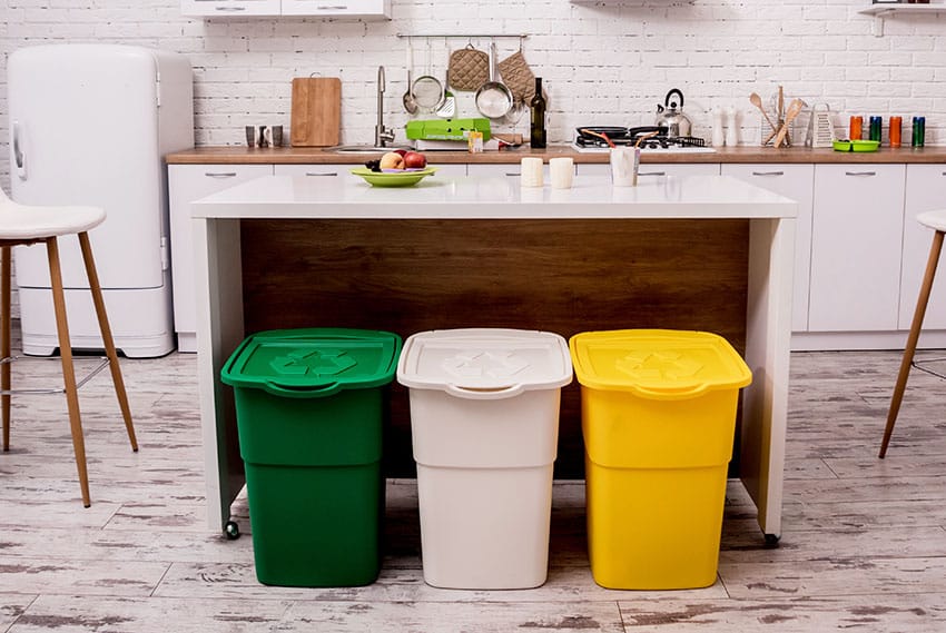 Kitchen with trash can moveable table brick wall