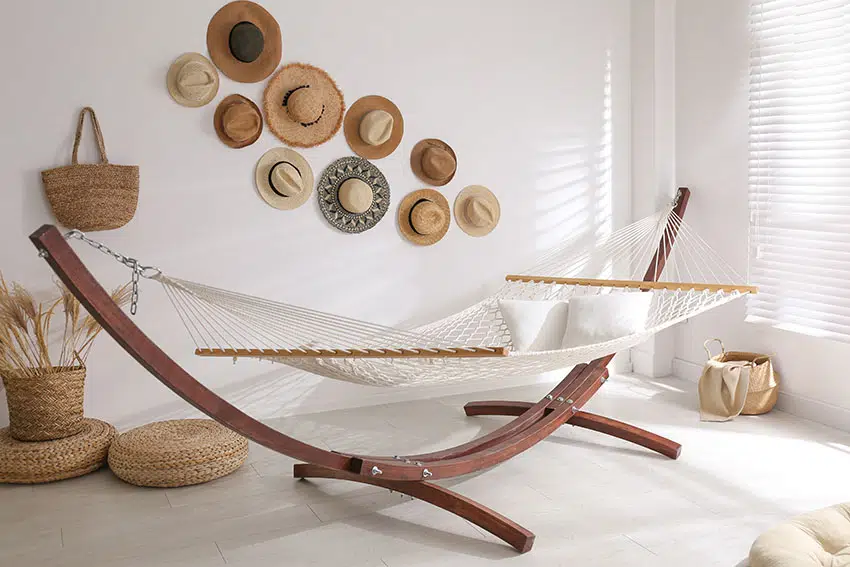 Stylish room with hammock decorative hats white paint