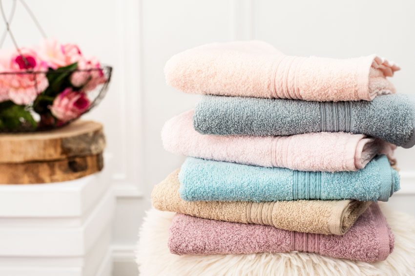 A stack of colorful cotton towels for home use