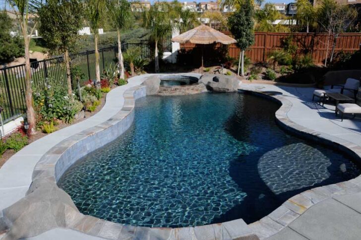 Gunite Pool Pros And Cons Colors Finishes   Backyard With Gunite Pool Concrete Deck Shade Hot Tub And Metal Fence Is 728x484 