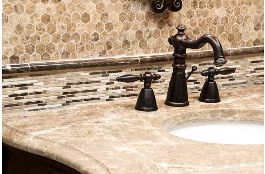 Bamboo mosaic tile backsplash in bathroom with countertop, sink, and faucet